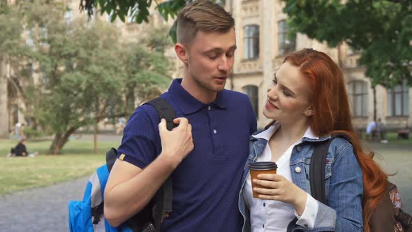 Couple of Students Flirts on Campus