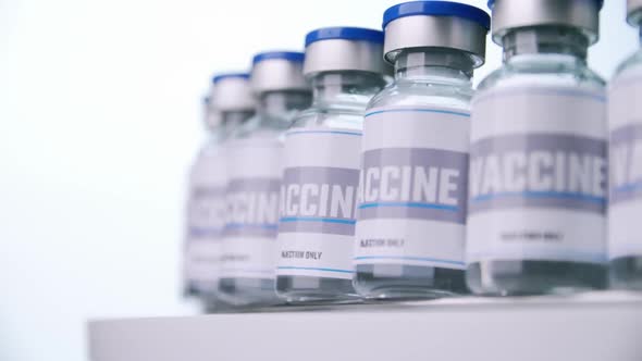 Glass vials for vaccine in laboratory. Group of vaccine bottles. Medicine in ampoules.