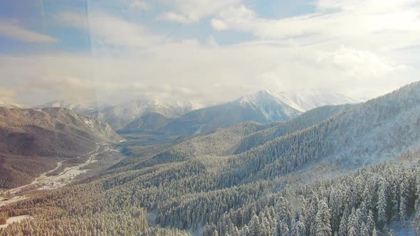 Aerial View Snow Covered Mountains and Ski Resort