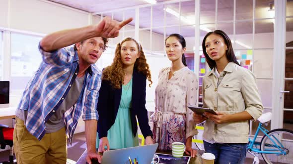 Group of business executives interacting with each other