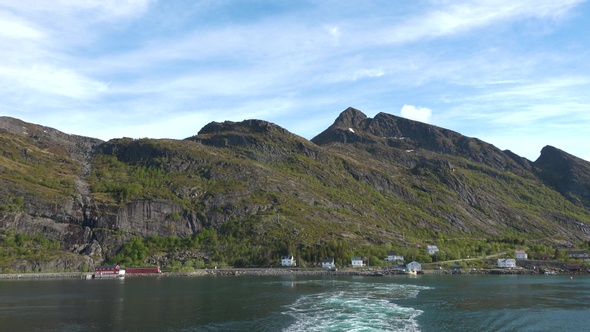 Cruise along the shore of the Norwegian fjord.