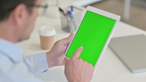 Middle Aged Man Using Tablet with Chroma Screen