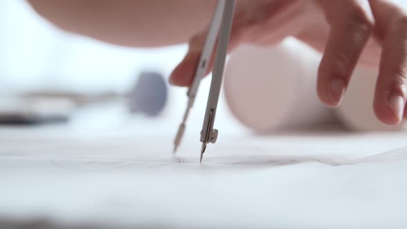 Close-up of an architect's hands. Professional real estate designer