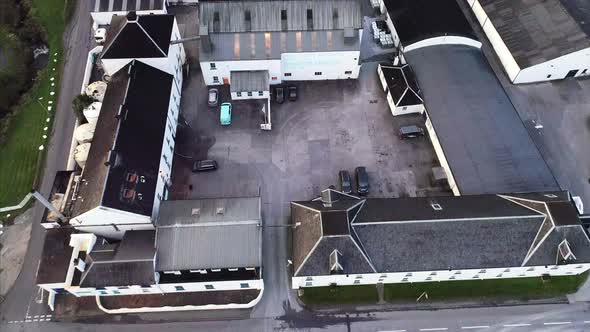 Flying Over a Distillery in Islay Scotland