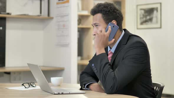African Businessman Talking on Phone