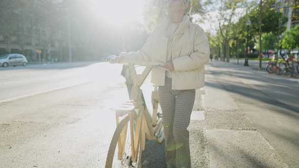 Female with Bicycle Enjoying Sunlight