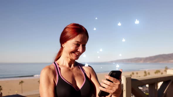 Mature Woman Exercising At The  Beach