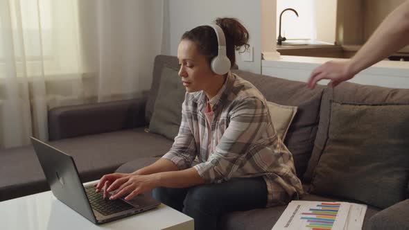 Woman Using Laptop Listening Music Someone Calling Her Out Indoors