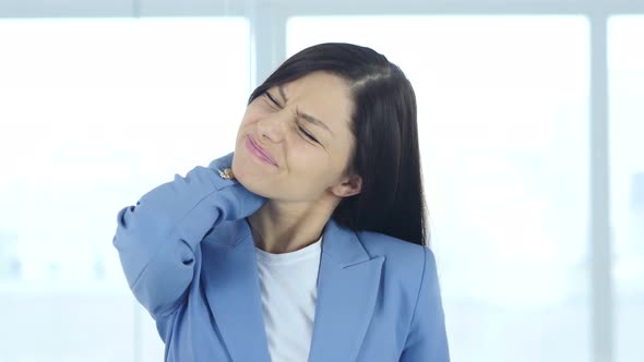 Young Businesswoman at Work with Neck Pain, Workload