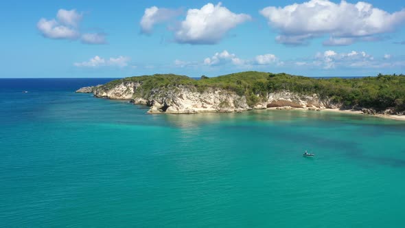 Macao Beach with Turquoise Water and Stone Cliff