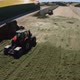 Copter flying around tractors in a silo on a farm - VideoHive Item for Sale