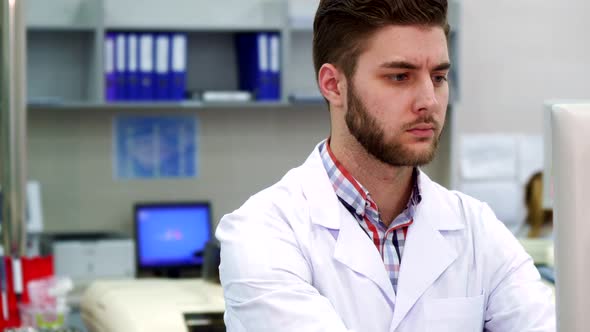 Man Uses Computer at the Laboratory