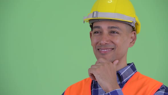 Face of Happy Multi Ethnic Man Construction Worker Thinking