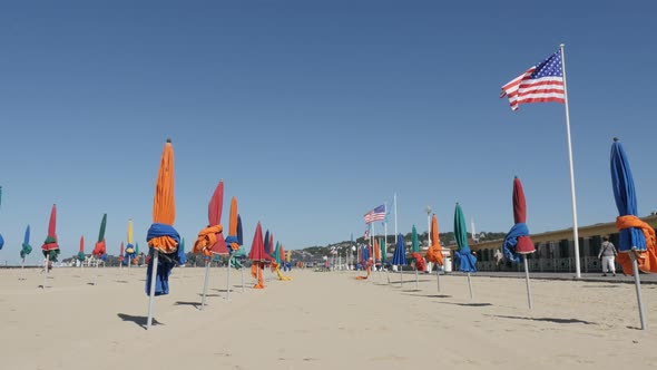 DEAUVILLE, FRANCE - SEPTEMBER 2016 Beach  walkway of famous film festival city with colorful sun pro