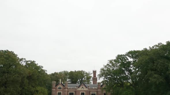 Tilt down from cloudy sky to Schaffelaar Castle in Barneveld, the Netherlands