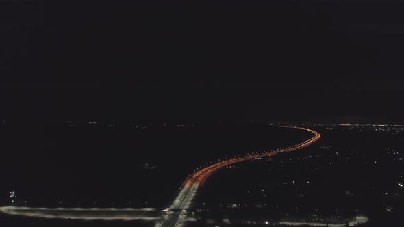Aerial view of Night highway with orange and white lanterns and lightning 06