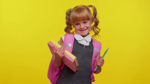 Funny Positive Kid Primary School Girl with Ponytails Wearing Uniform Smiling on Yellow Background