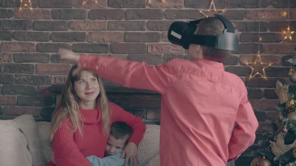 Small Boy Catches Something in Air Using Virtual Glasses