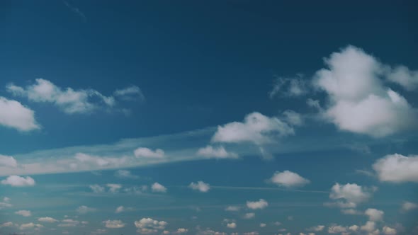 Light Cloudy Blue Sky With Fluffy Clouds