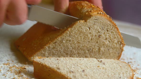 Cutting Bread with Knife Slowmotion