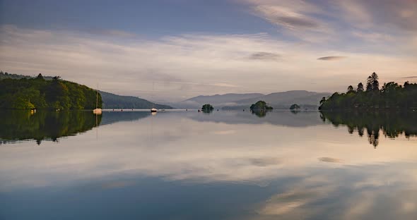 Lake District sunrise landscape time lapse at Lake Windermere. 4k timelapse of perfect reflection of