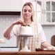 Pastry Chef Confectioner Young Caucasian Woman with Cake on Kitchen Table - VideoHive Item for Sale