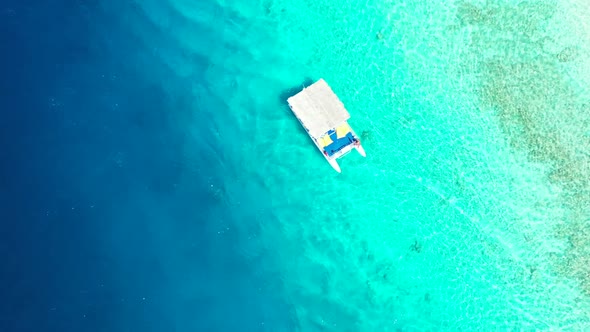 Aerial drone view panorama of tropical coast beach vacation by aqua blue lagoon and white sandy back