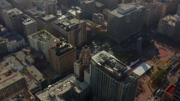 AERIAL: View on Roof Construction Side in Downtown Los Angeles, Daylight 