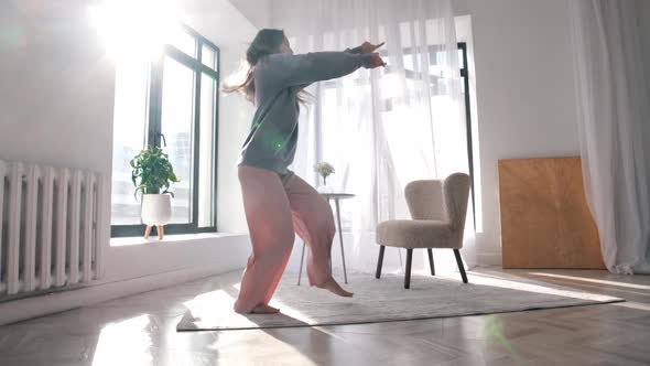 Modern Dancing  a Young Woman with Beautiful Long Hair Dancing in a Spacious Apartment