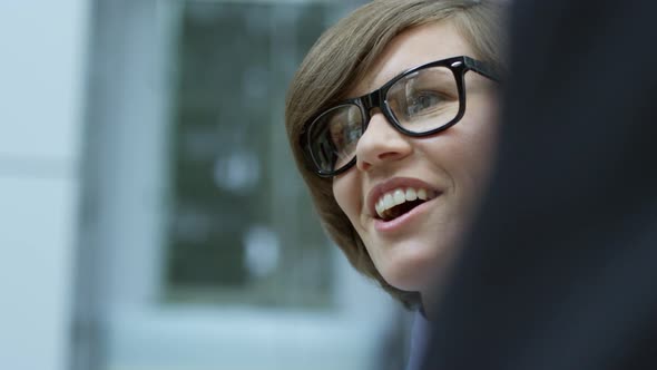 Young Businesswoman Talking to Colleagues