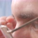 A Man Puts on Closeup Glasses - VideoHive Item for Sale