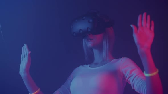 Caucasian Young Girl Wearing Virtual Reality Headset, Moving Hands in the Air, Touching Virtual