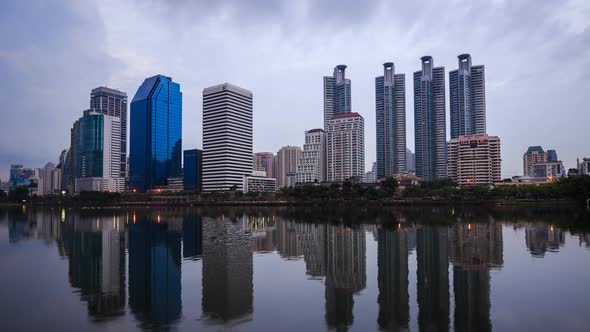 day to night Time-lapse of Bangkok city view at Benjakitti Park, Bangkok, Thailand.