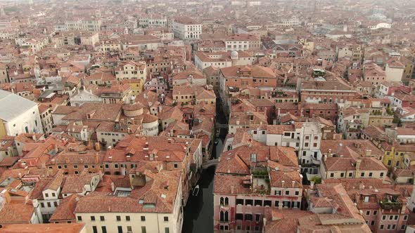 Venice - flying over rooftops and canals of the city, Italy