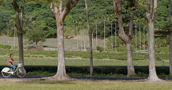 Woman ride a bike in countryside