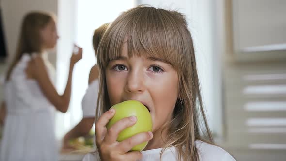 Girl is Eating a Big Green Apple alt
