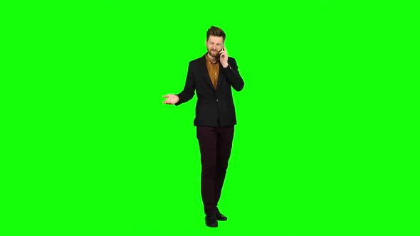 Businessman Talking on the Phone and Nervous, Shouts. Green Screen