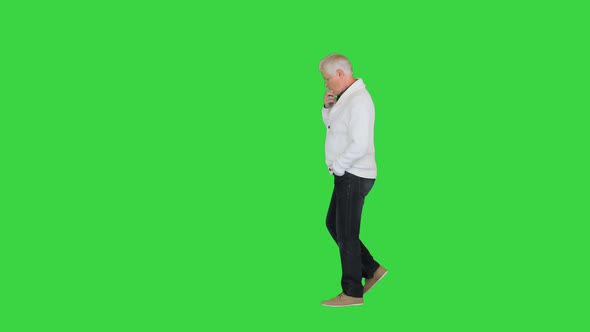 Senior Mature Man Thinking or Trying Hard To Remember Something on a Green Screen Chroma Key