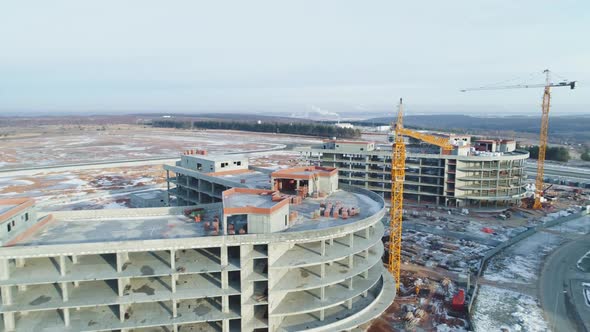 Building Materials on Future Office Center Roof and Cranes