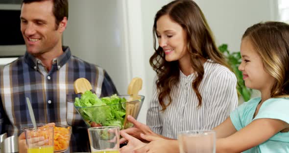 Family having healthy meal together at home