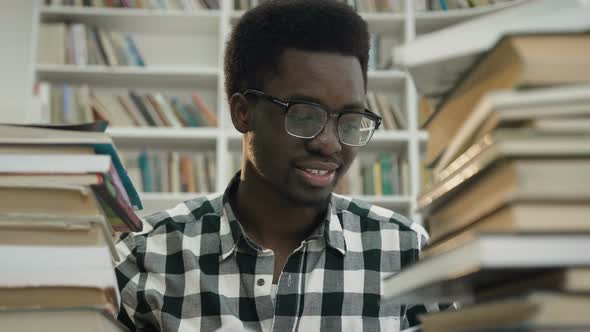 African Young Man in the Library