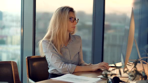 Serious Online Trader Work On Stock Market Data. Saleswoman Analyzing Charts On Computer.