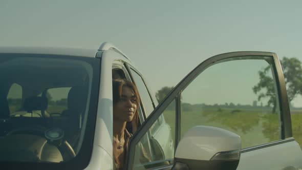 Lovely Relaxed African American Woman Driver Looking at Scenic Summer Nature