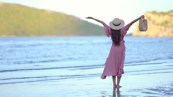 Asian woman enjoy around beautiful beach sea ocean