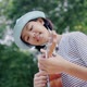 Beautiful Asian teenage girl playing at ukulele in the park, Slow motion - VideoHive Item for Sale