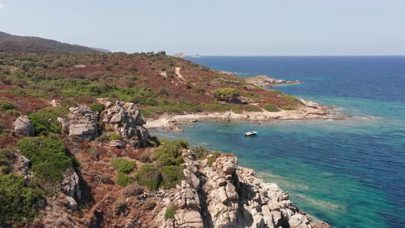 Aerial View of White Rock Hills with Arid Vegetation Sand Beach Waves Crushing on the Beach