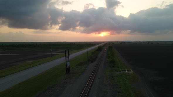 Aerial Shot Over Empty Railroad Tracks At Sunset In Texas, U.S.A.