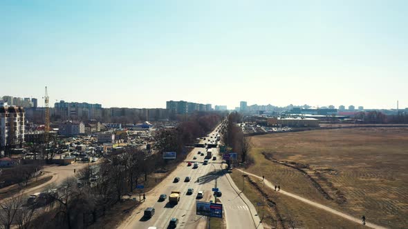 Ascending aerial shot, ring road in Kiev, Ukraine on a sunny day.