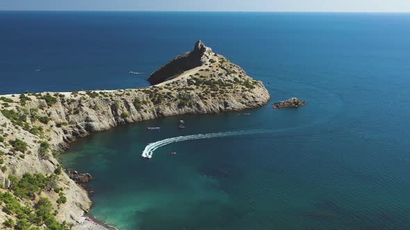 Flight Over a Boat Sailing in the Bay. View From the Drone