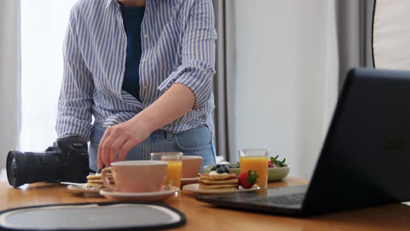 Food Photographer with Camera Working in Kitchen